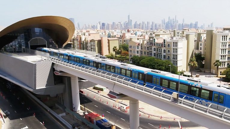 Al Furjan metro station with the Dubai skyline beyond