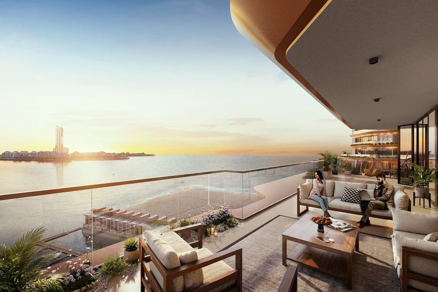 Terrace of a Waterfront residence at Al Hamra, looking over the beach and the water at sunset